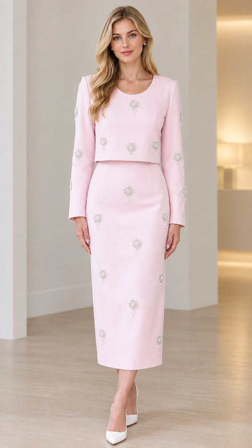 Front full view of light pink two-piece embellished midi dress set with long sleeves