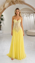 Front full-length view of yellow strapless sweetheart lace and pleated evening gown