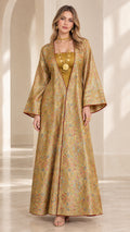 Front full-length view of woman wearing gold floral jacquard open front maxi abaya with bell sleeves