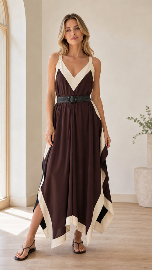 Model wearing Chocolate Brown V-neck handkerchief maxi dress with cream contrast trim and belt - front view