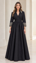 Front full-length view of model wearing black embellished collar A-line maxi dress