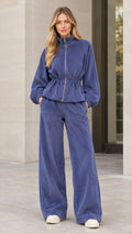 Front view of woman wearing slate blue corduroy zip jacket and wide leg pants set