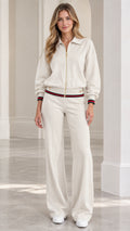 Full front view of women's cream collared zip-up tracksuit set with wide-leg pants