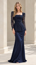 Front full view of woman wearing Navy Blue beaded lace peplum evening gown with long sleeves