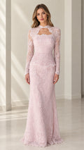 Front full view of woman wearing blush pink long sleeve lace evening gown with cutout neckline