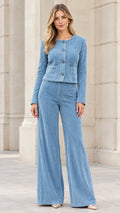 Front view of model wearing light blue ribbed collarless jacket and wide leg pants set