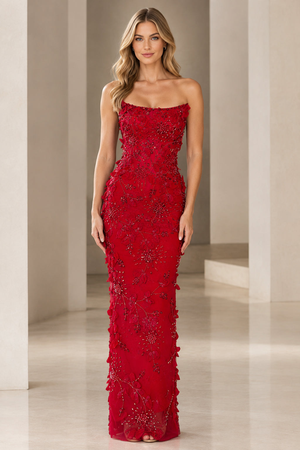 Model wearing red strapless 3D floral beaded column evening gown front view