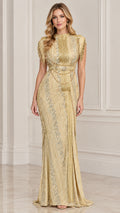 Front view of woman wearing gold high neck beaded evening gown with shoulder fringe