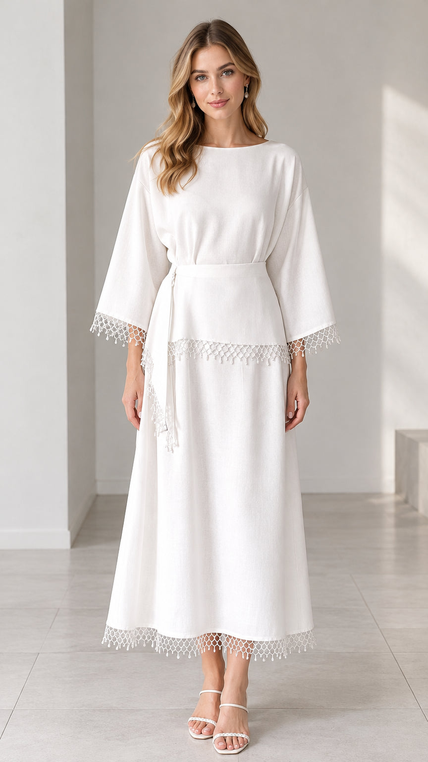 Front full view of woman wearing white belted maxi dress with crochet lace trim