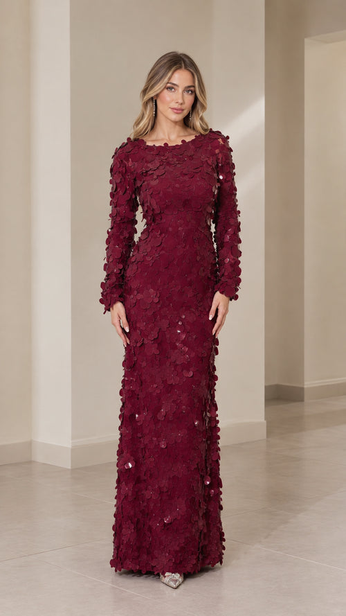 Front view of woman wearing burgundy 3D floral appliqué long sleeve maxi dress
