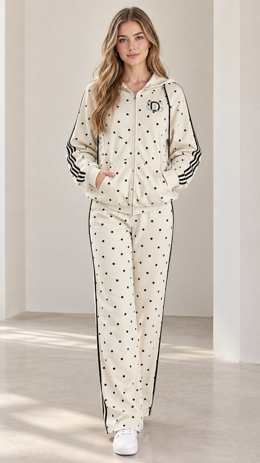 Full front view of model wearing cream polka dot zip-up hoodie and matching straight-leg pants set