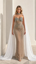 Front view of model wearing champagne beaded evening gown with sheer cape