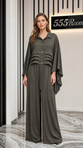 Front view of model wearing olive pleated blouse and wide-leg pants set