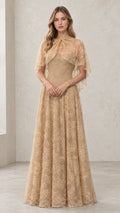 Front view of woman wearing Champagne embroidered lace capelet evening gown