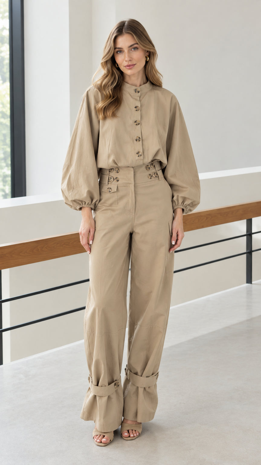 Front full view of woman wearing khaki utility two-piece blouse and wide leg pants set