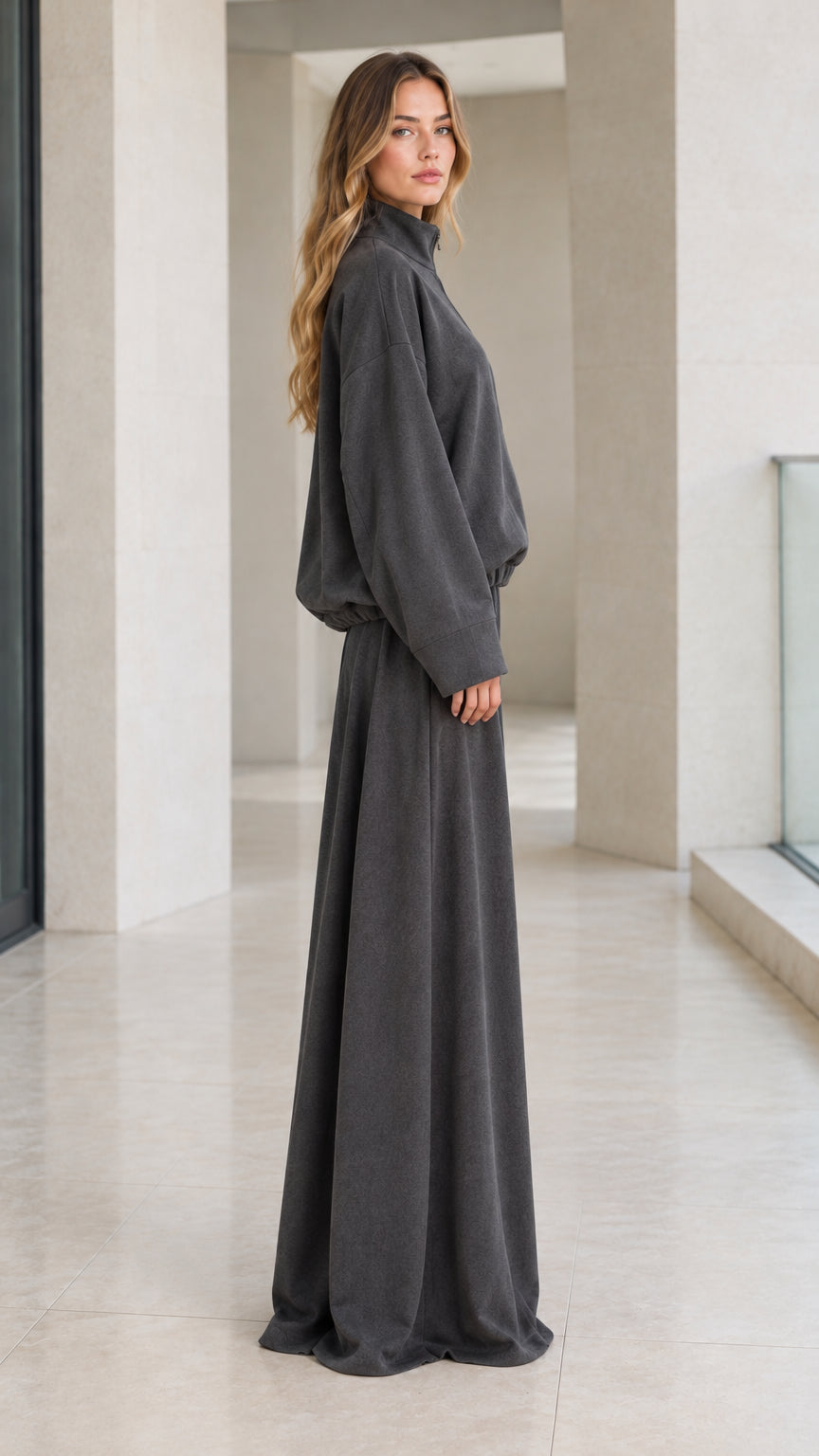 Side profile view of woman modeling charcoal grey two-piece wide-leg lounge set