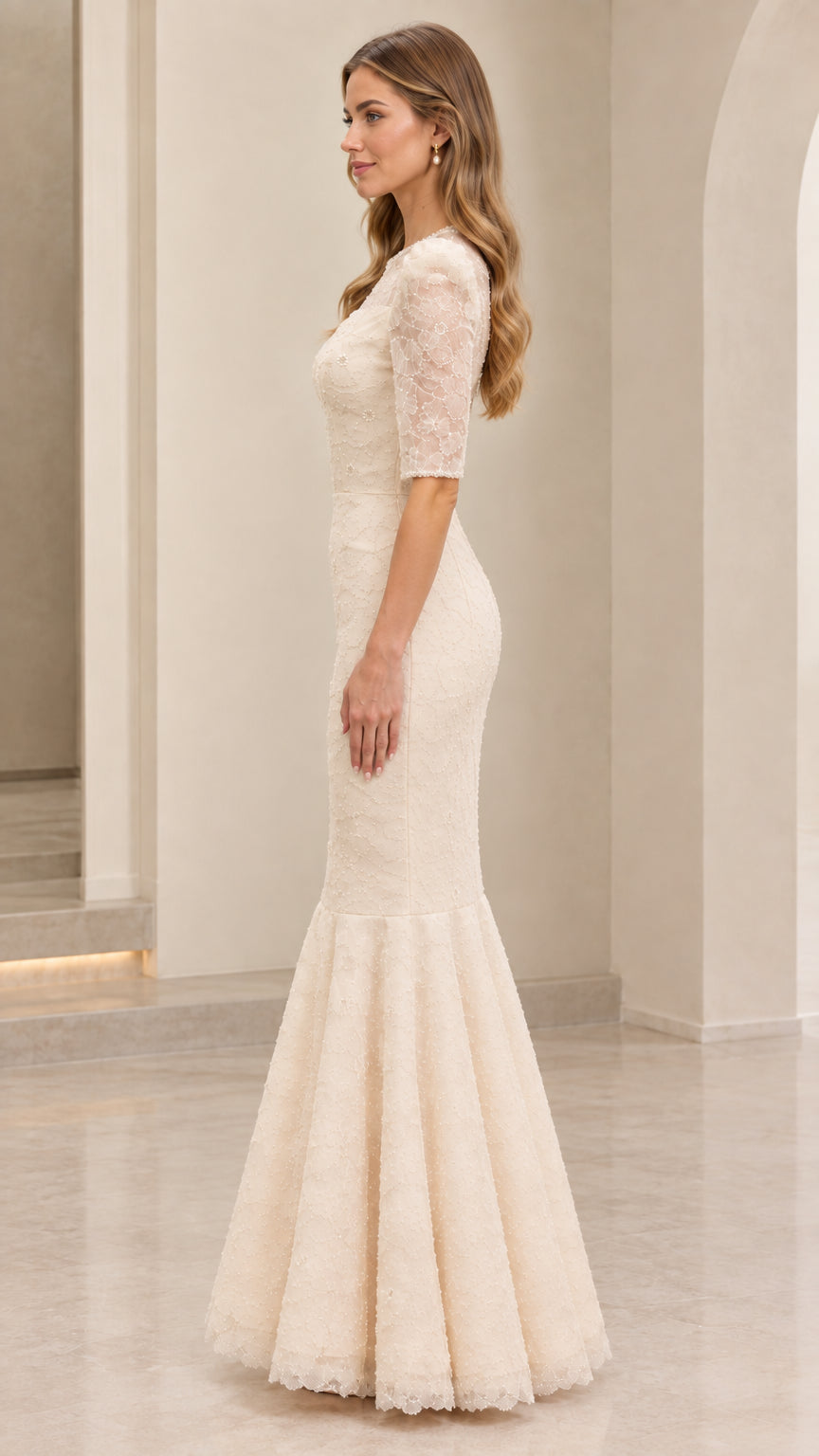 Side profile view of cream lace floor-length mermaid gown