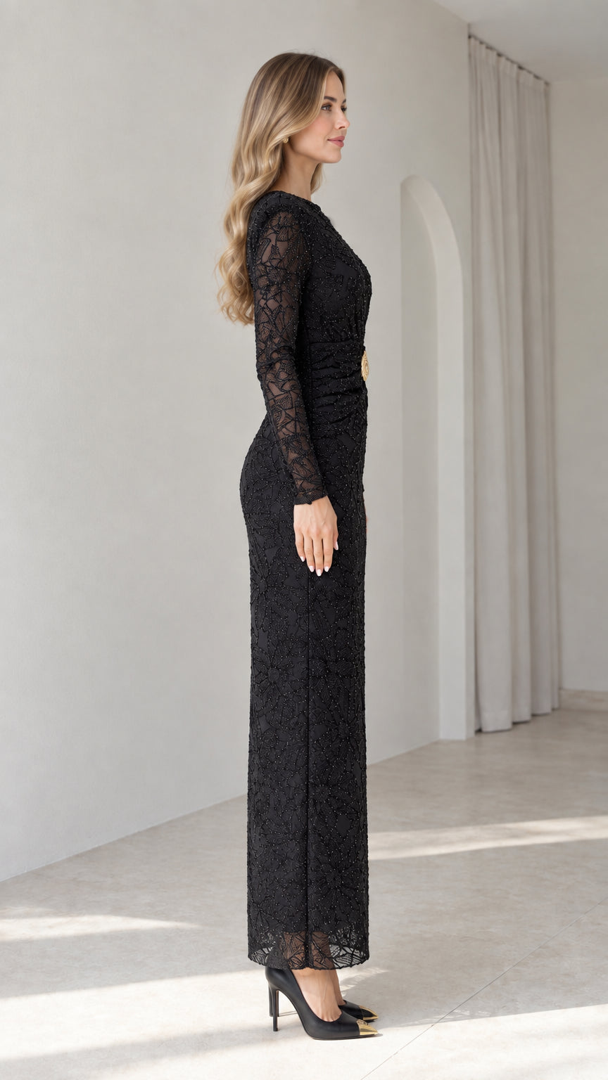 Side view of model in elegant black lace column gown