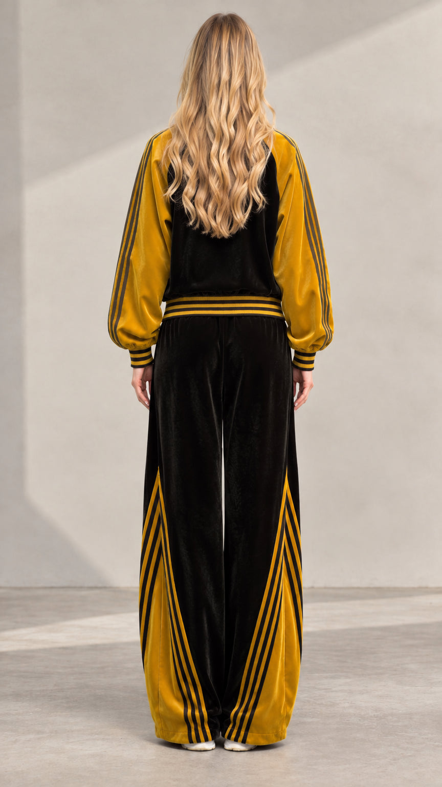 Back view of women's velvet matching jacket and pants set