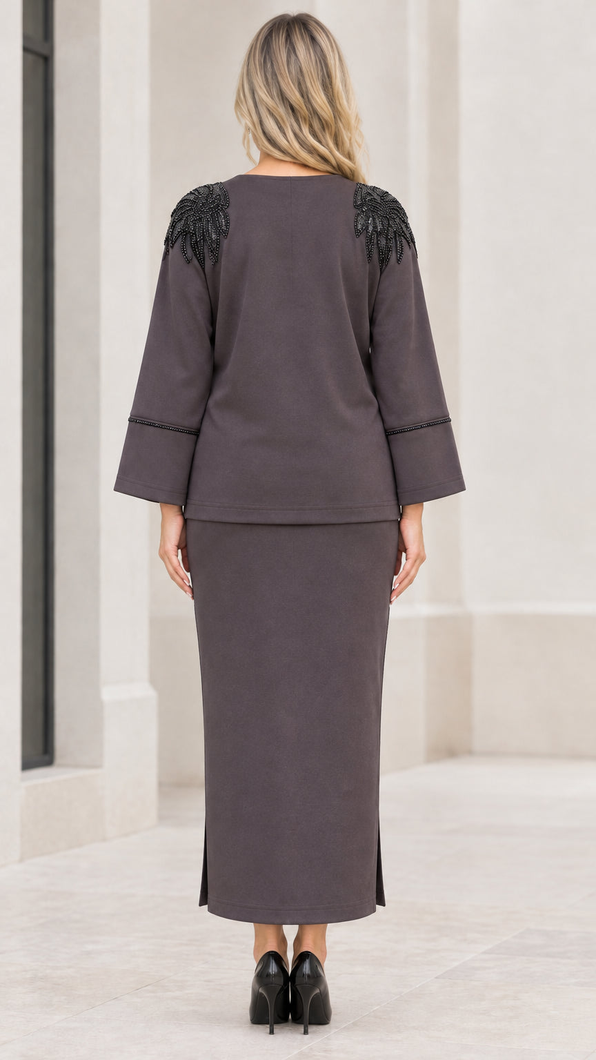 Back view of charcoal grey skirt set showing beaded shoulder details