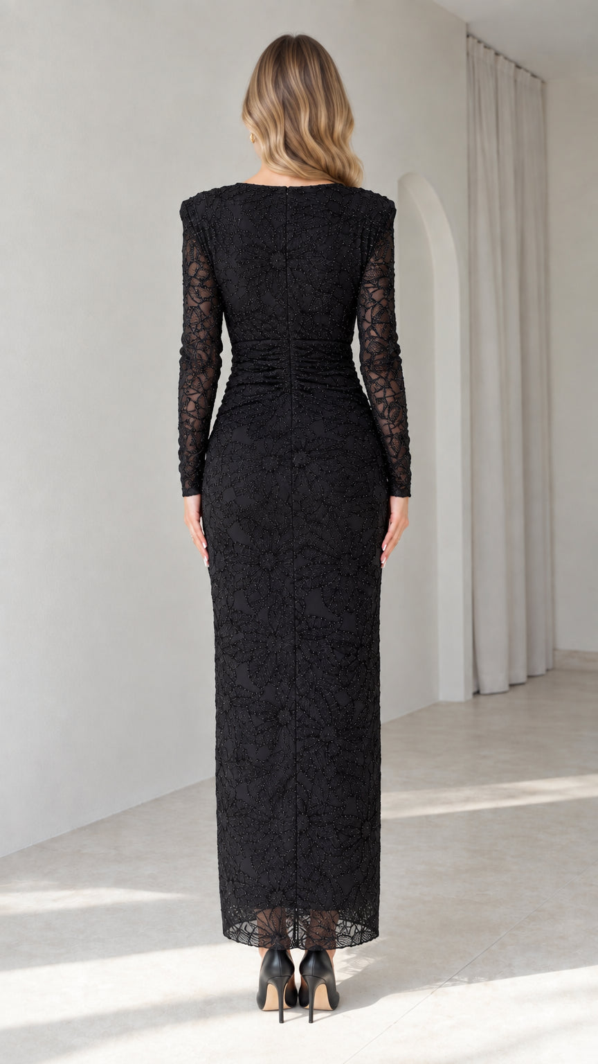 Back view of model in black long sleeve lace evening dress