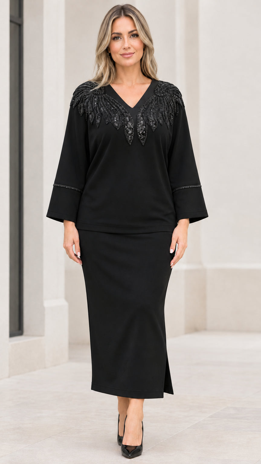 Full front view of black sequin-embellished top and maxi skirt two-piece set
