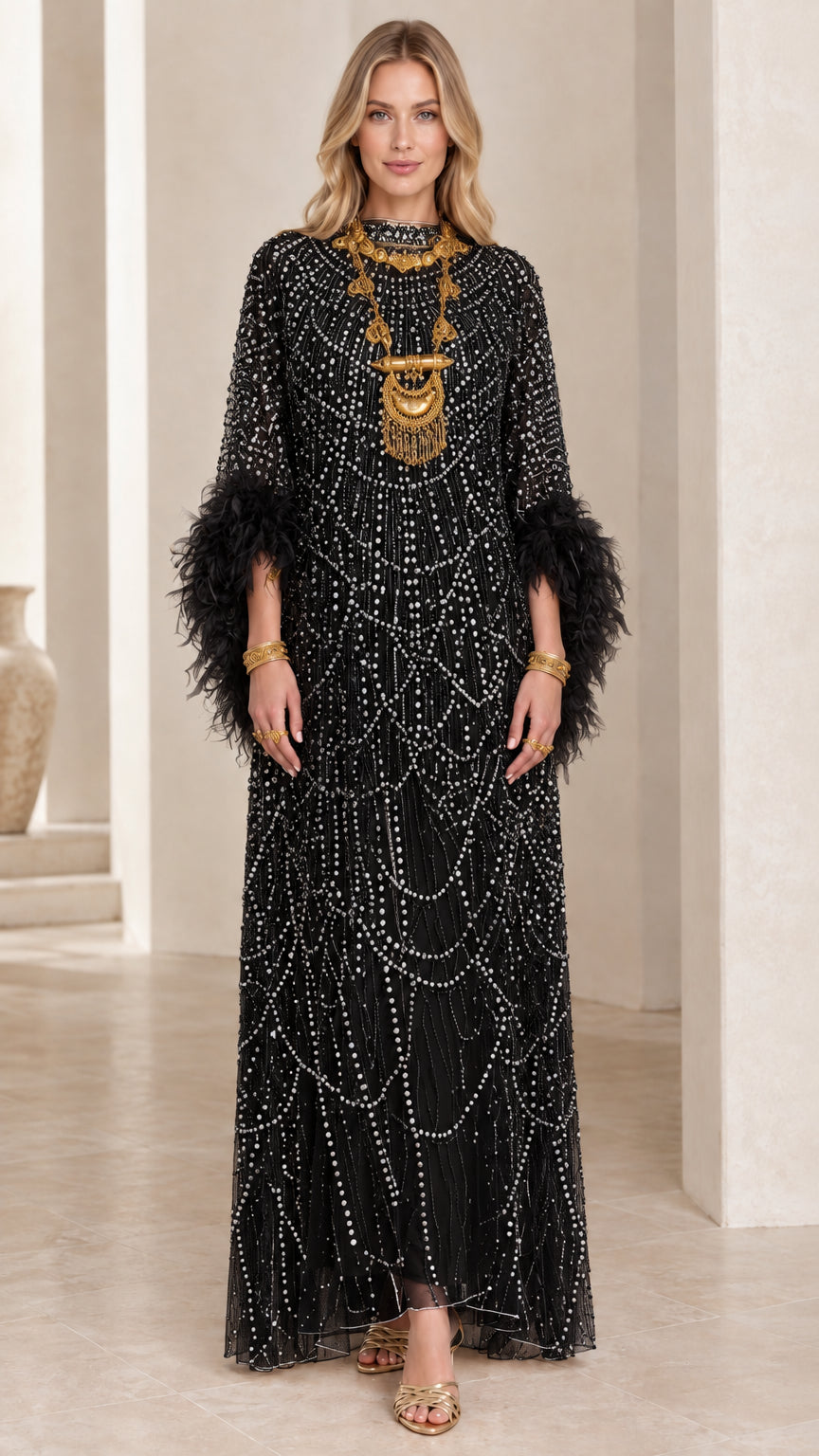 Front view of black beaded maxi dress with matching feather cuffs