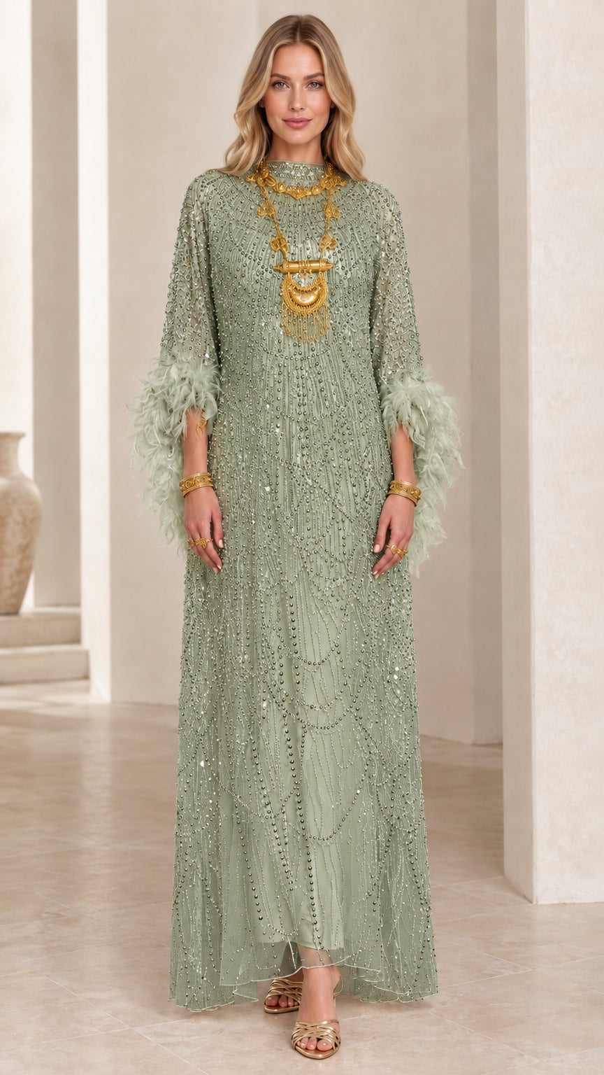 Front view of sage green beaded maxi dress with feather cuffs
