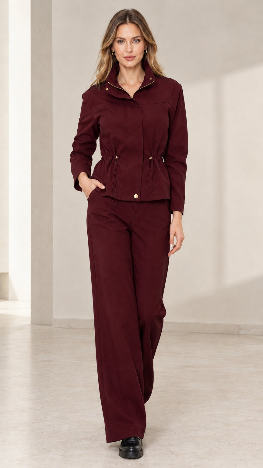 Model wearing Burgundy utility jacket and matching wide-leg trousers set