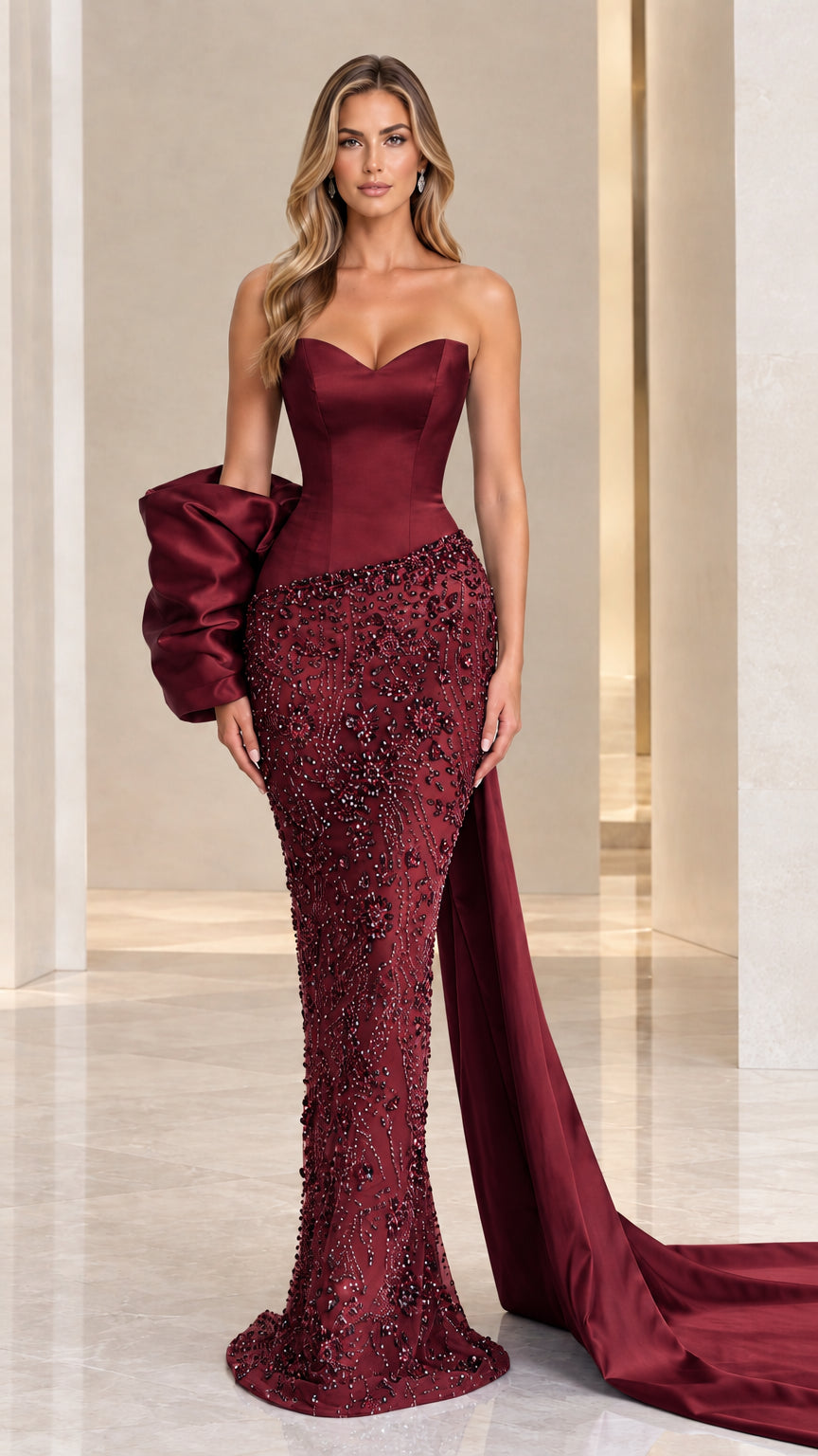 Full-length burgundy wine red strapless beaded evening gown with statement cascading train